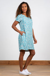 A model wearing the Seascape Dress in colour Seafoam (Blue), from the front, showing the whole outfit