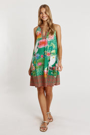 A model wearing the Akiko Sundress in colour Sea (Green), from the front, showing the whole outfit