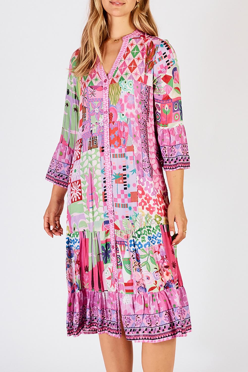 A model wearing the Aliah Midi Dress in colour Fuchsia (Pink), from the front, cropped image