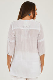 Model Georgia wearing size S of the Ariana Shirt in colour White (White), from the back