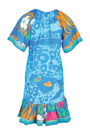Product shot of the Ashanti Dress – Ocean in colour Ocean, from the back