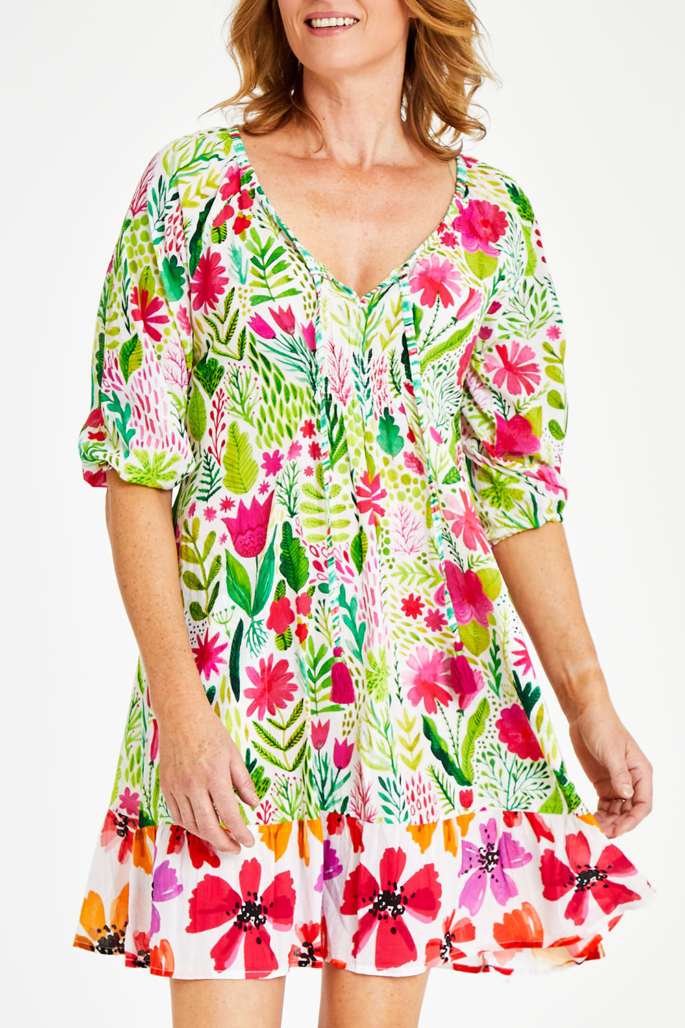 Model Naomi wearing size S of the Austin Shirred Dress in colour Sea (Green), from the front, cropped image