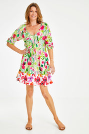 Model Naomi wearing size S of the Austin Shirred Dress in colour Sea (Green), from the front, showing the whole outfit