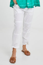 Model Katie wearing size M of the Beach Pant in colour White (White), from the front, cropped image