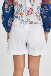 Model Katie wearing size S of the Beach Short in colour White (White), from the back