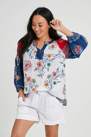 Model Katie wearing size S of the Beach Short in colour White (White), from the front, cropped image