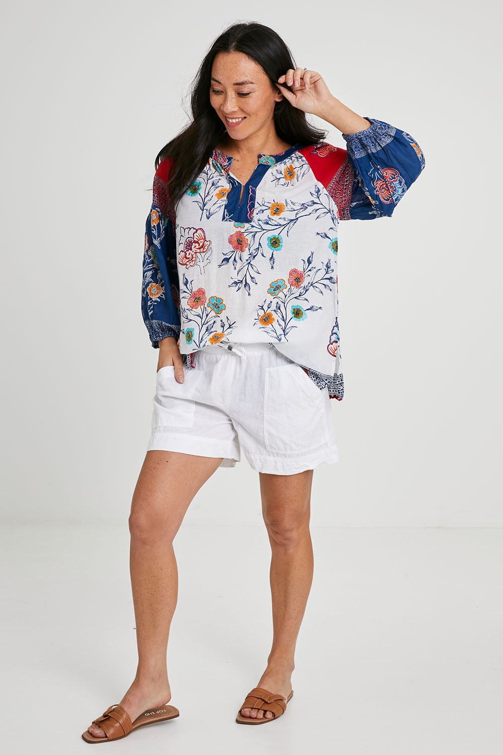 Model Katie wearing size S of the Beach Short in colour White (White), from the front, showing the whole outfit