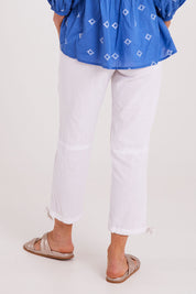 Model Luisa wearing size S of the Beach Pant in colour White (White), from the back
