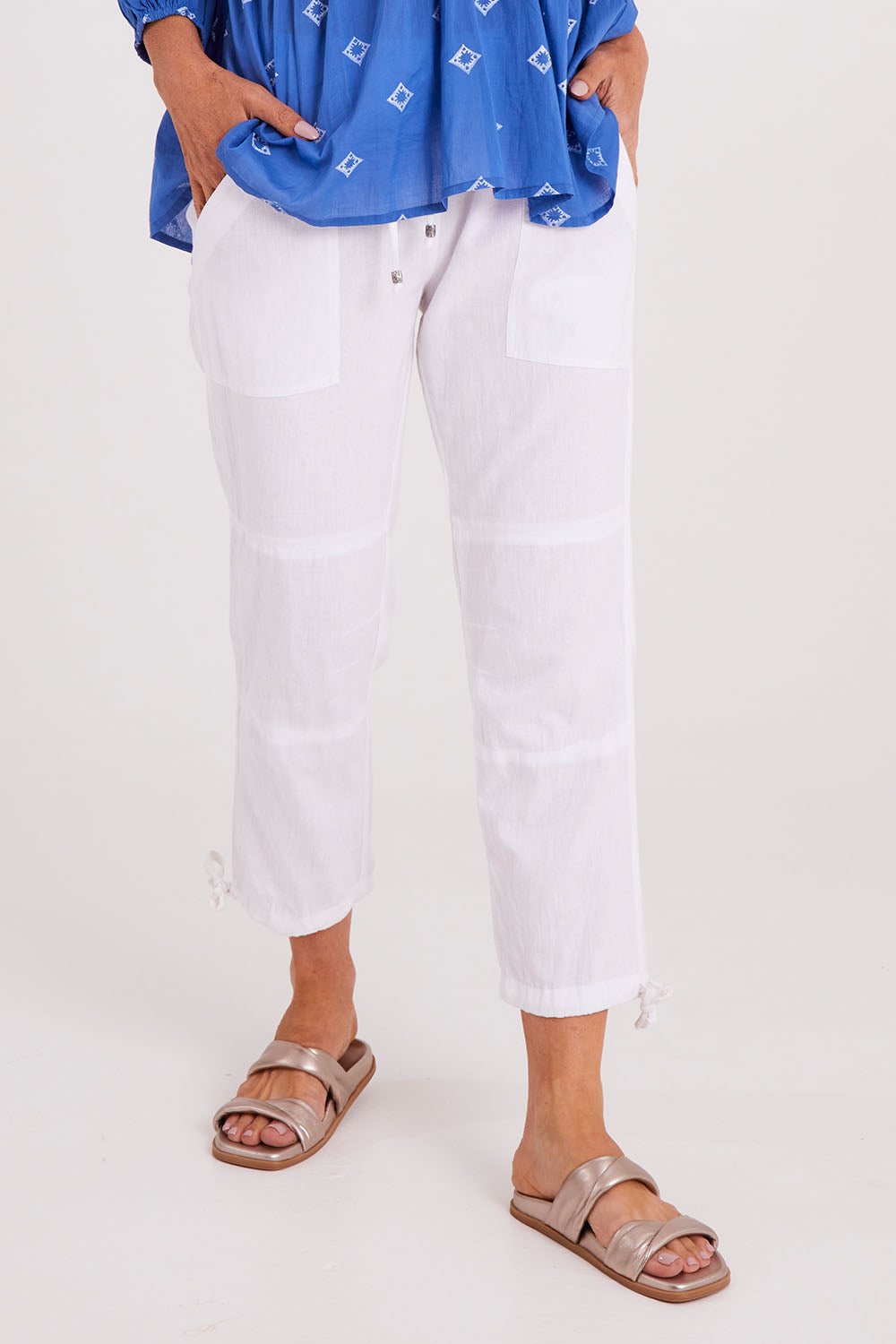 Model Luisa wearing size S of the Beach Pant in colour White (White), from the front, cropped image