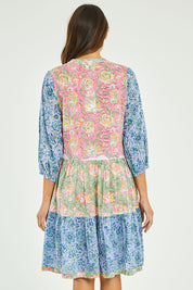 Model Madeline wearing size S of the Bessie Dress in colour Multi (Blue), from the back