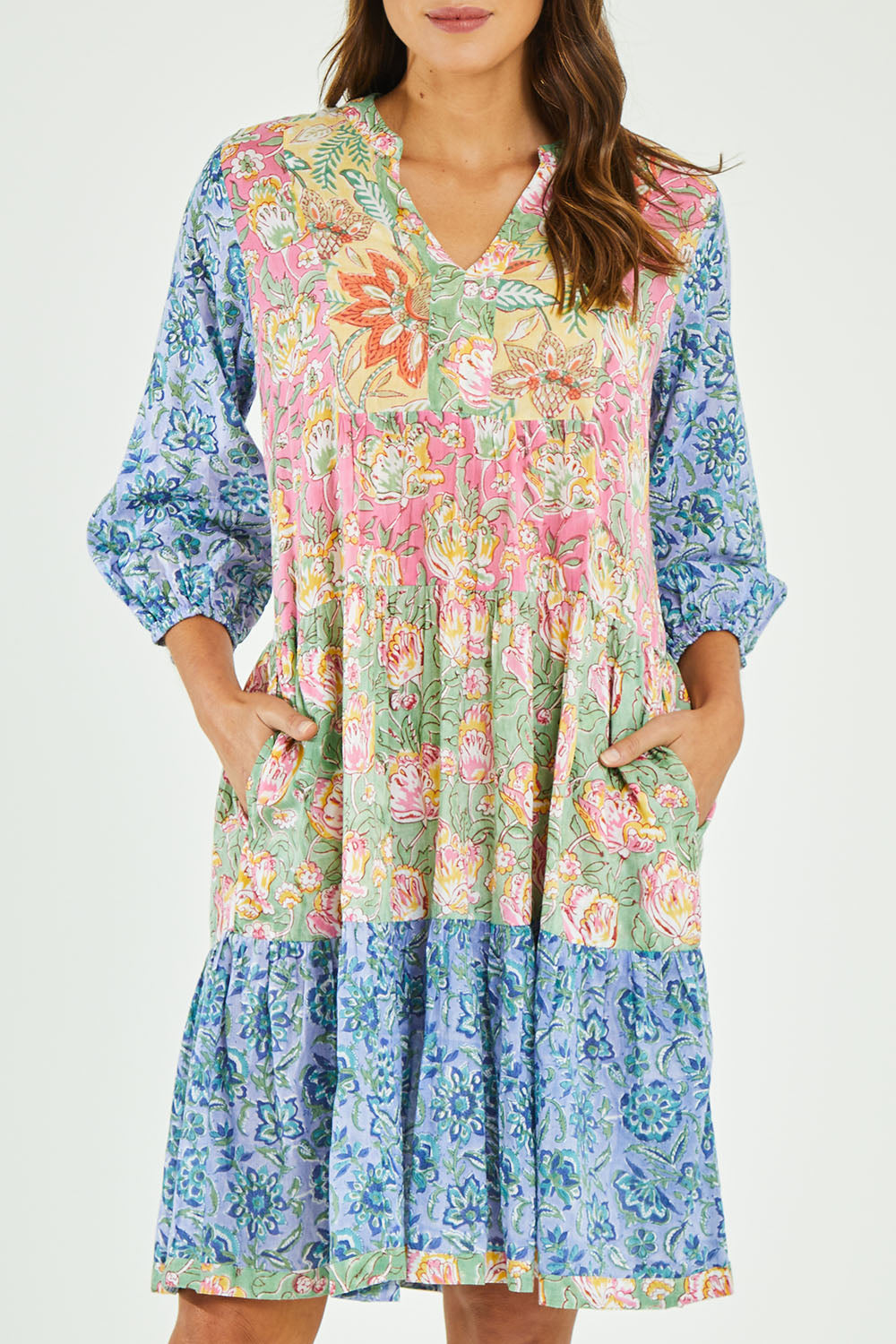 Model Madeline wearing size S of the Bessie Dress in colour Multi (Blue), from the front, cropped image