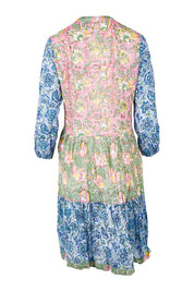 Product shot of the Bessie Dress in colour Multi (Blue), from the back