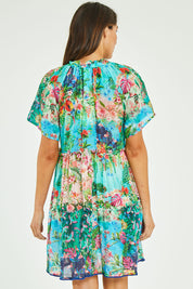 Model Madeline wearing size S of the Bonnie Dress in colour Print (Blue), from the back