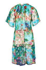 Product shot of the Bonnie Dress in colour Print (Blue), from the back