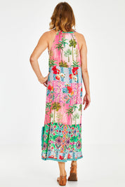 Model Naomi wearing size S of the California Maxi in colour Sunset (Pink), from the back