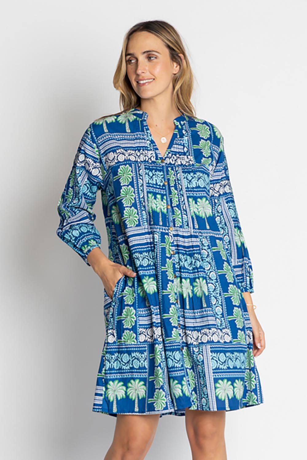 A model wearing the Catira Cotton Dress in colour Ocean (Blue), from the front, cropped image