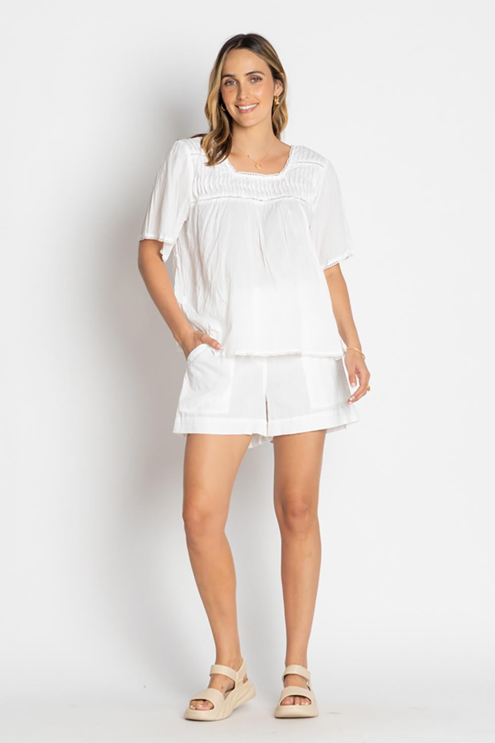 A model wearing the Celeste Cropped Cotton Top in colour White (White), from the front, showing the whole outfit