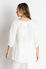 A model wearing the Celeste Cotton Top in colour White (White), from the back