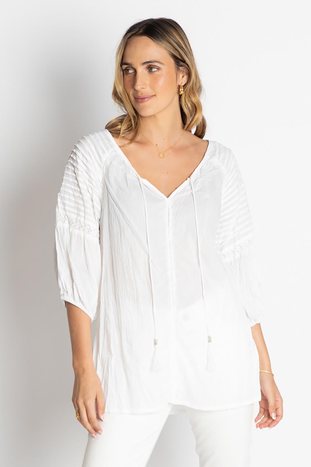 A model wearing the Celeste Cotton Top in colour White (White), from the front, cropped image