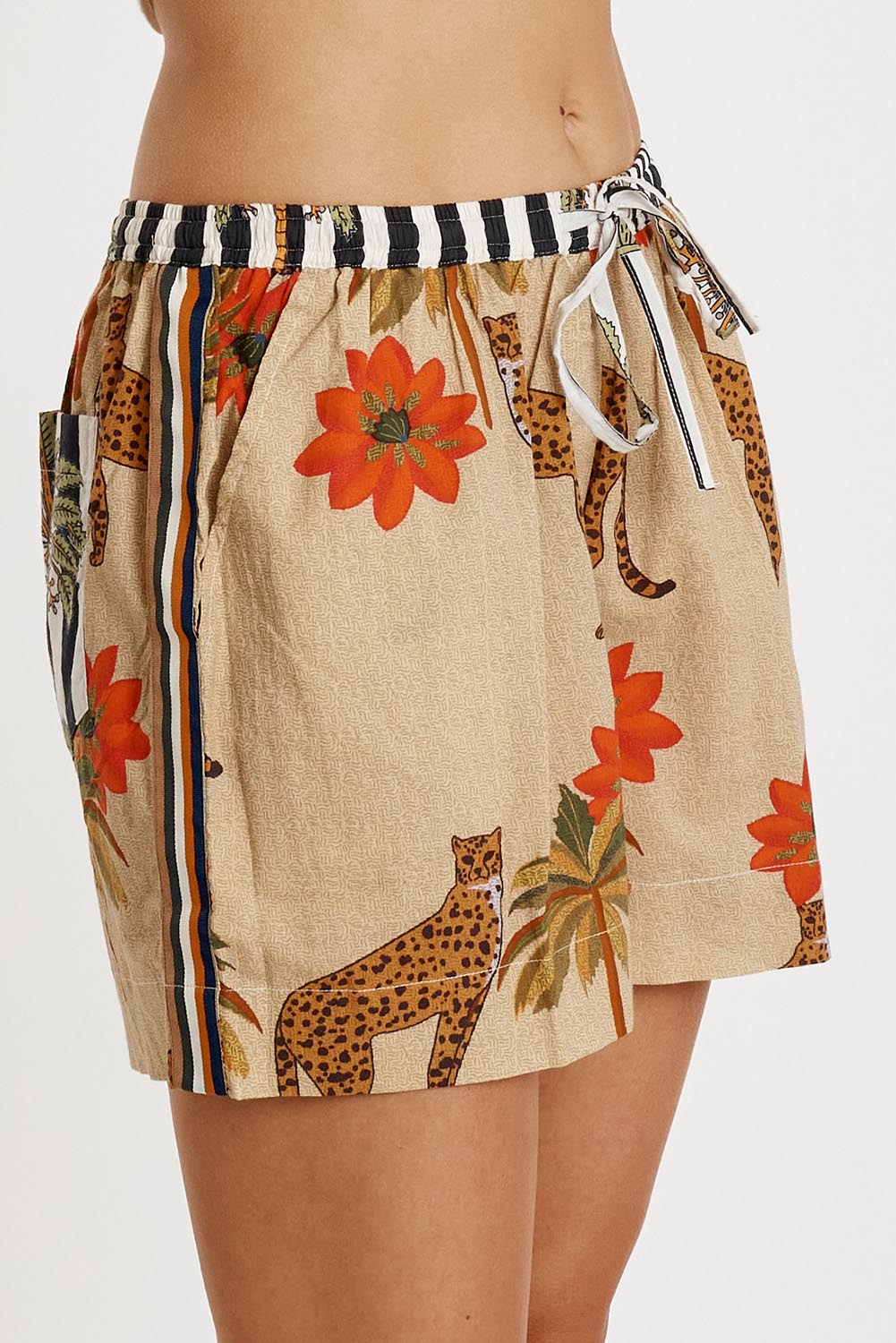 A model wearing the Congo Cotton Short in colour Natural, from the front, cropped image