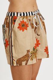 A model wearing the Congo Cotton Short in colour Natural, from the front, cropped image
