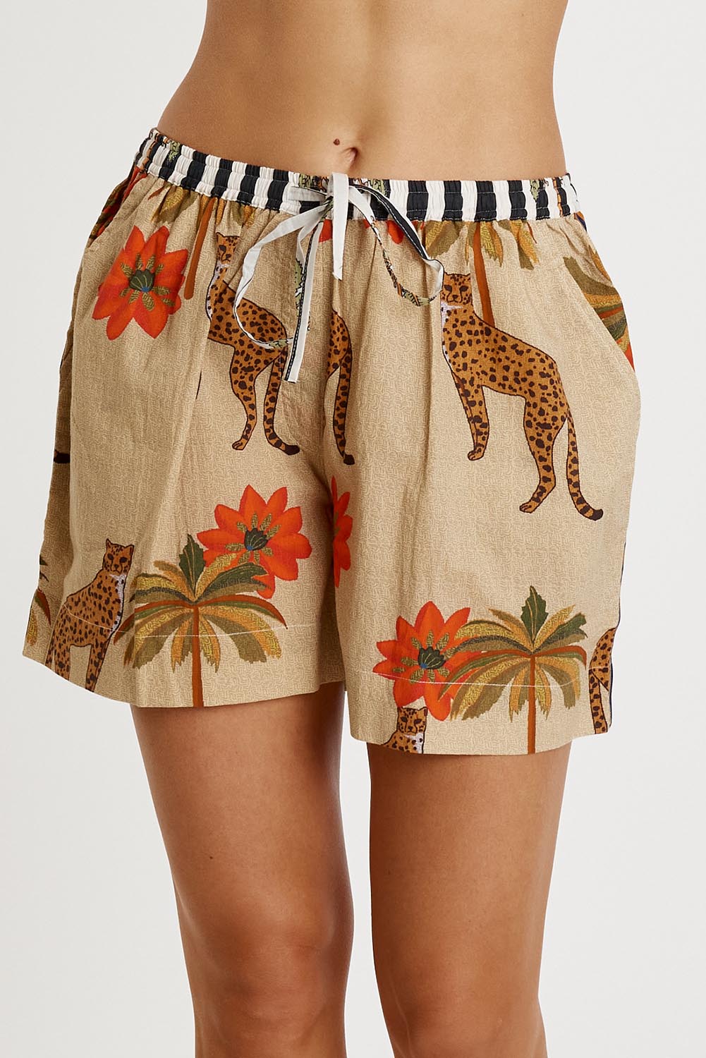 A model wearing the Congo Cotton Short in colour Natural, from the front, cropped image