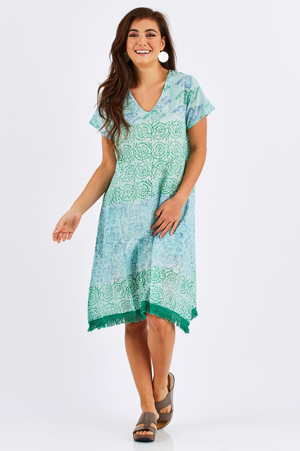 Model Chesska wearing size S of the Delphi Dress in colour Sea (Green), from the front, showing the whole outfit