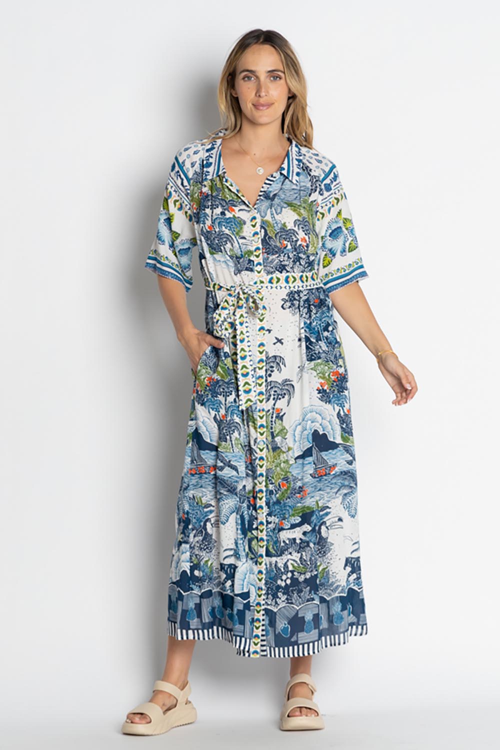 A model wearing the Dita Maxi Shirtdress in colour Ocean (Blue), from the front, showing the whole outfit