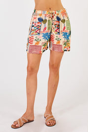 A model wearing the Ellery Short in colour Cream, from the front, cropped image