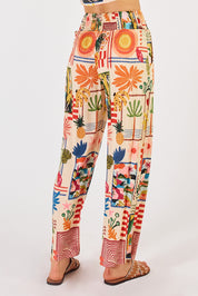 A model wearing the Ellery Pant in colour Cream, from the back