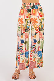 A model wearing the Ellery Pant in colour Cream, from the front, cropped image