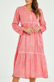 Model Madeline wearing size S of the Ethel Midi Dress in colour Melon (Pink), from the front, cropped image