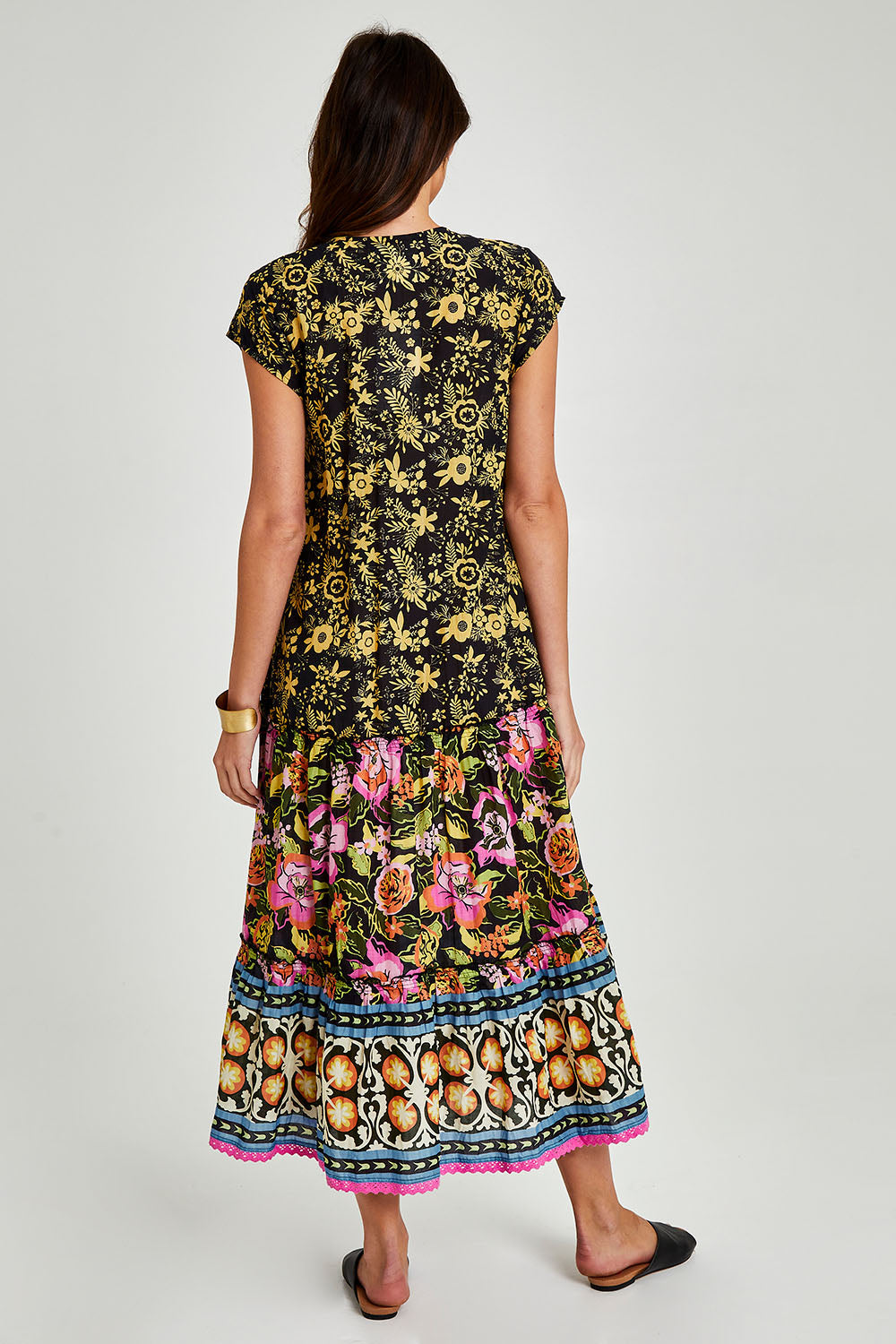 Model Madeline wearing size S of the Hart Maxi in colour Print (Black), from the back