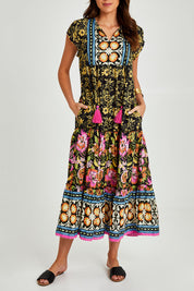 Model Madeline wearing size S of the Hart Maxi in colour Print (Black), from the front, cropped image