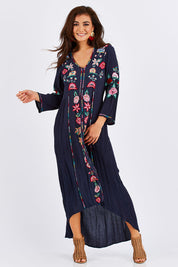 Model Chesska wearing size S of the Hayman Dress in colour Navy (Blue), from the front, showing the whole outfit