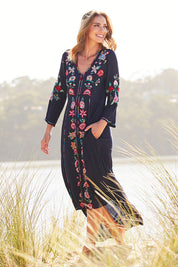 Model Riina wearing size S of the Hayman Dress in colour Navy (Blue), from the front, showing the whole outfit