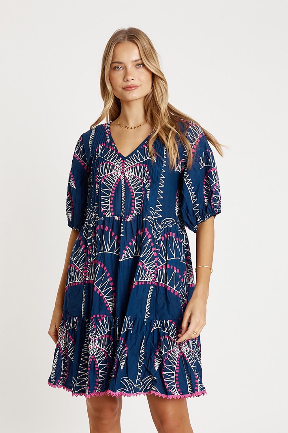 A model wearing the Idalia Cotton Dress in colour Navy (Blue), from the front, cropped image