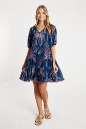 A model wearing the Idalia Cotton Dress in colour Navy (Blue), from the front, showing the whole outfit