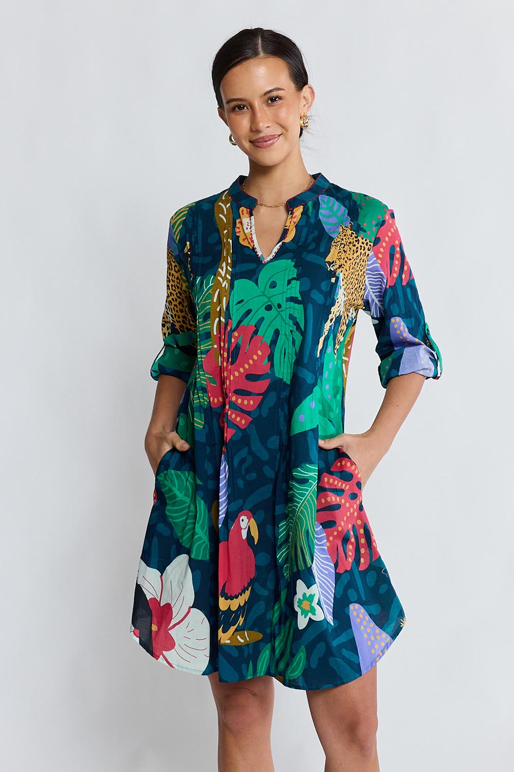 Model Genericm wearing size sample of the Jungle Fever Tuck Dress – Navy in colour Navy, from an angle