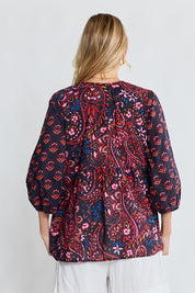 Model Genericm wearing size sample of the Kamila Top – Navy in colour Navy, from the back