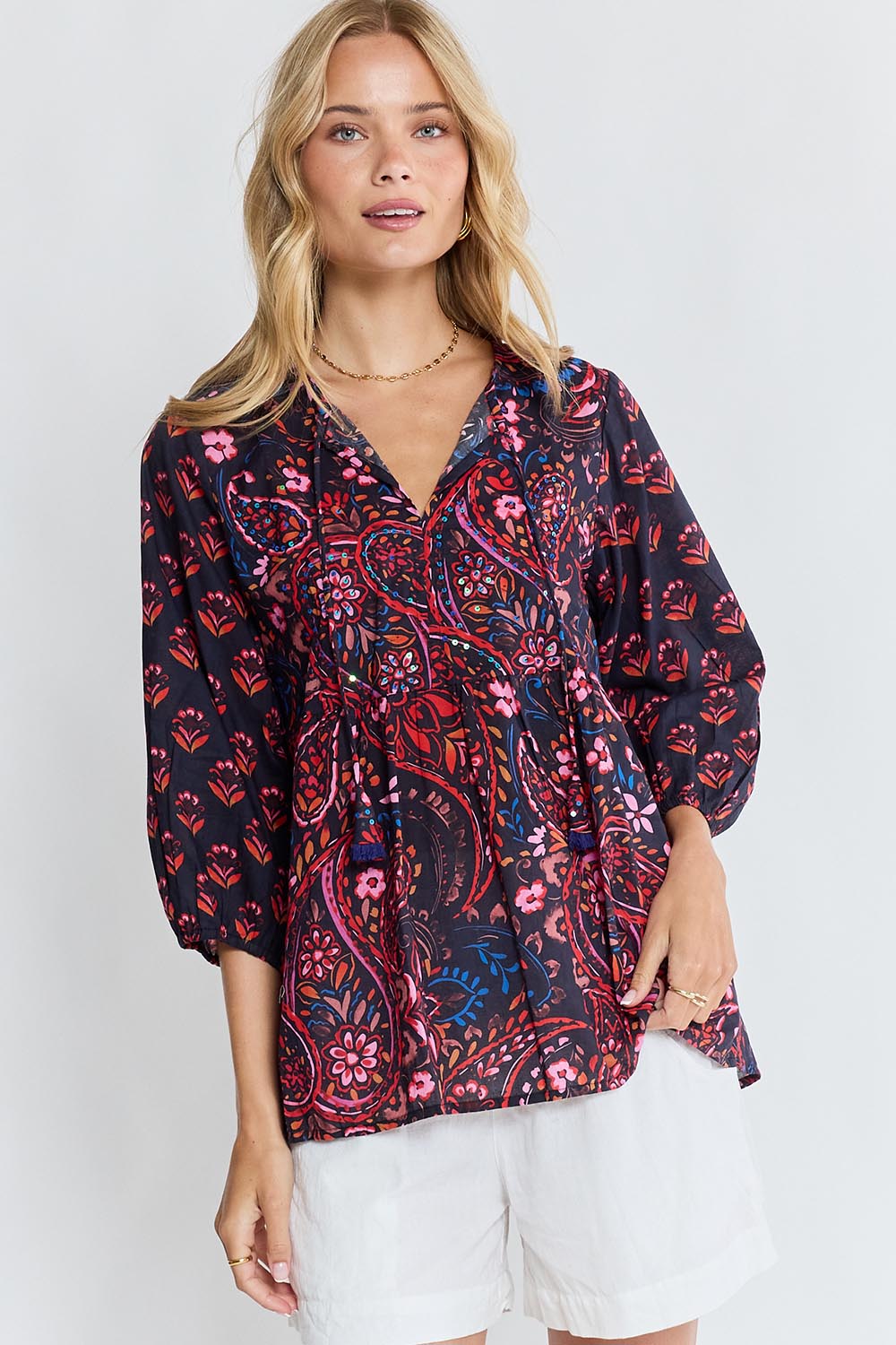 Model Genericm wearing size sample of the Kamila Top – Navy in colour Navy, in a cropped view