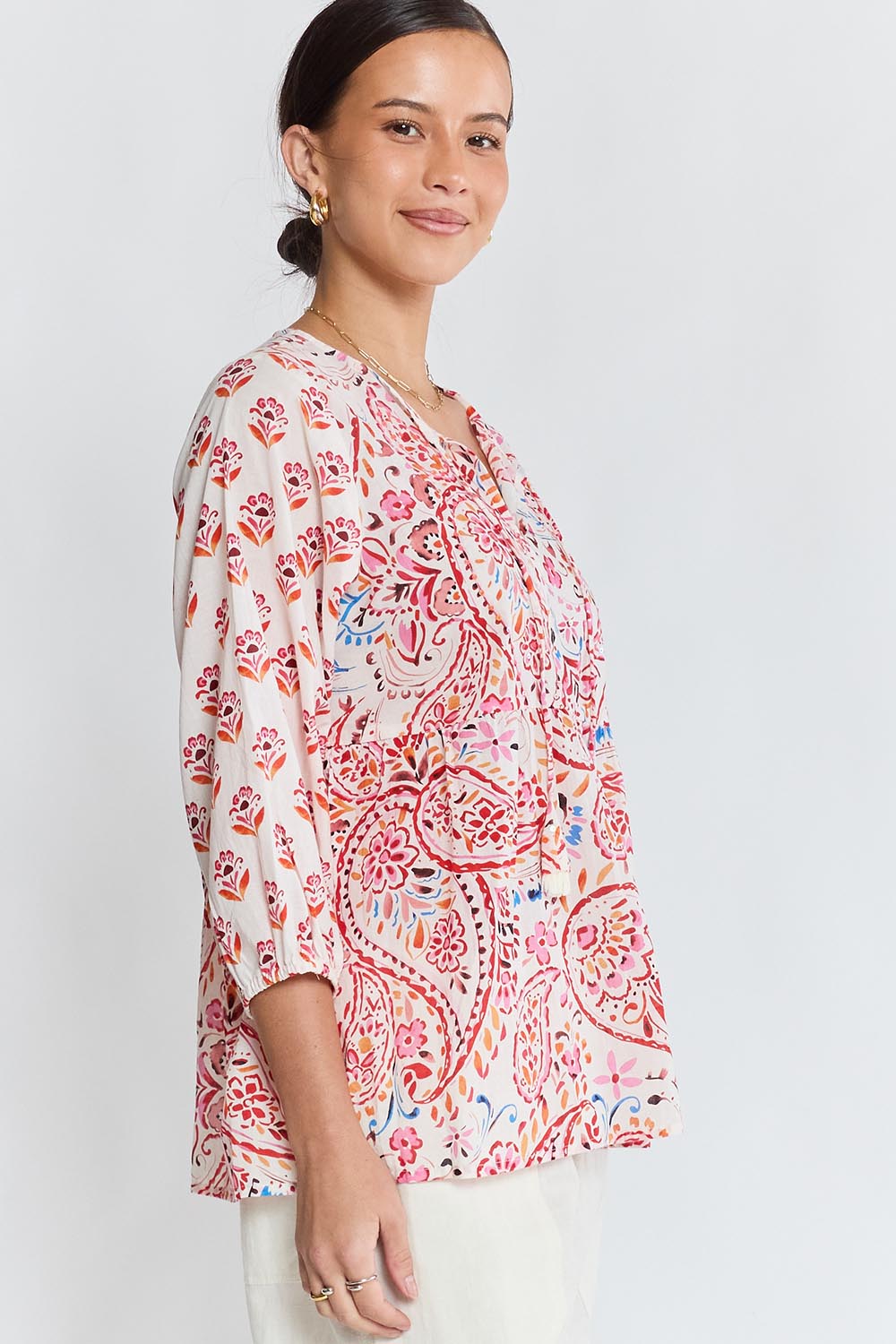 Model Genericm wearing size sample of the Kamila Top – White in colour White, from an angle