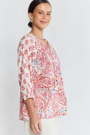 Model Genericm wearing size sample of the Kamila Top – White in colour White, from an angle