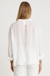 A model wearing the Keziah Cotton Shirt in colour White (White), from the back