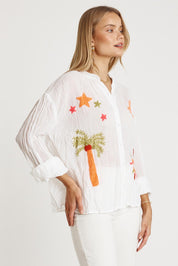 A model wearing the Keziah Cotton Shirt in colour White (White), from the front, cropped image