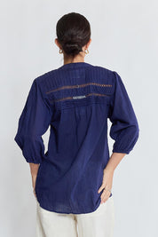 Model Genericm wearing size sample of the Laverne Tuck Shirt – Navy in colour Navy, from the back