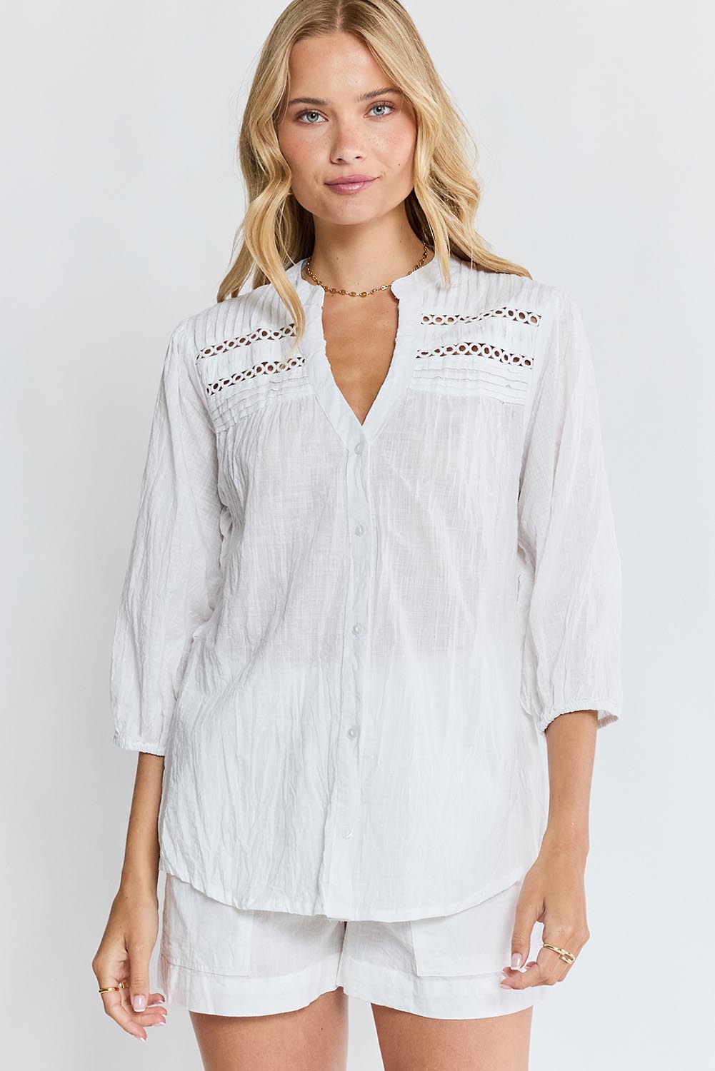 Model Genericm wearing size sample of the Laverne Tuck Shirt – White in colour White, in a cropped view