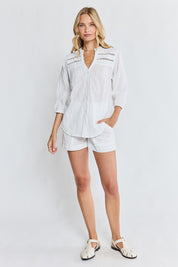 Model Genericm wearing size sample of the Laverne Tuck Shirt – White in colour White, from the front