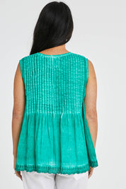 Model Katie wearing size S of the Leila Tank in colour Sea (Green), from the back