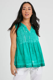 Model Katie wearing size S of the Leila Tank in colour Sea (Green), from the front, cropped image